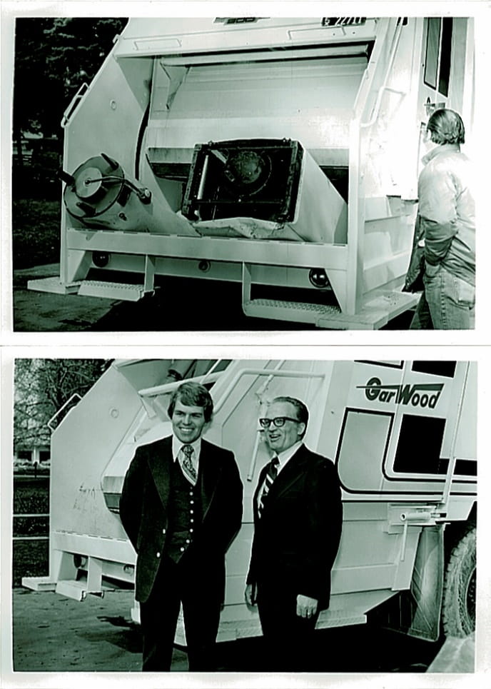 Fred T. Smith standing beside the Heil Formula 5000, a patented high-compaction, rear-loading garbage truck he invented.